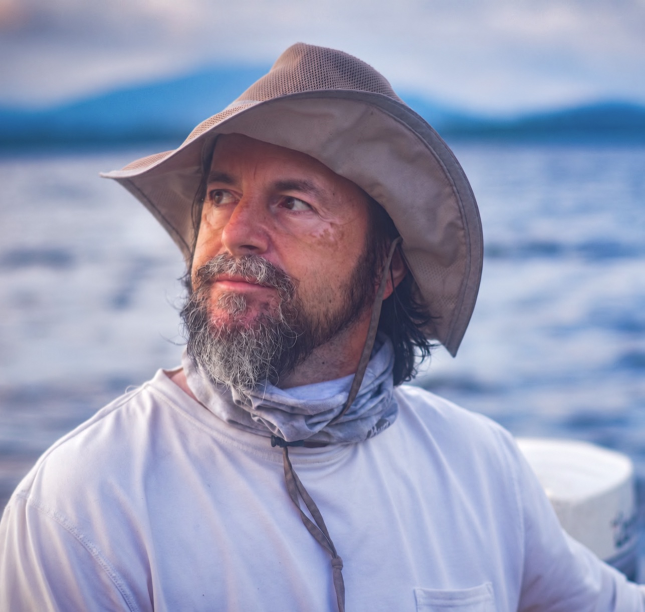 Richard deCosta outdoors beside the water